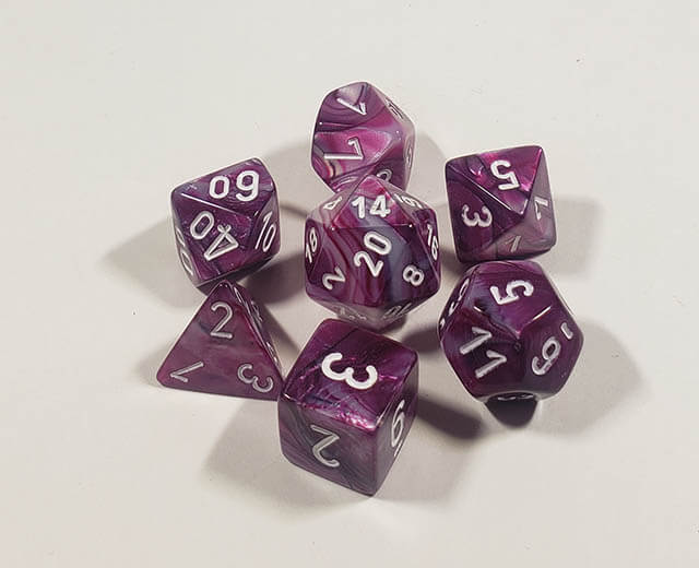 A close up of the Chessex Lustrous Amethyst polyhedral dice set.