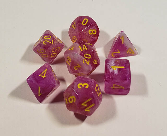A close up of the Chessex Leaf Fuscia polyhedral dice set.
