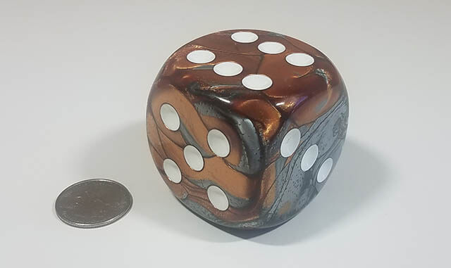 Swirled copper and steel 50mm d6 with quarter for scale