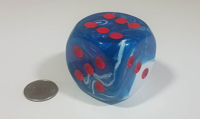 Swirled blue and white 50mm d6 with quarter for scale