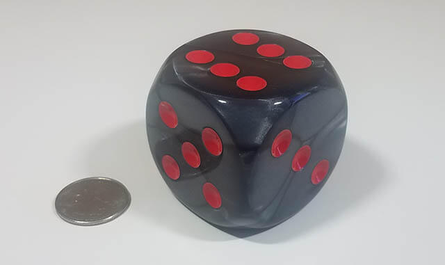 Smooth black 50mm d6 with quarter for scale