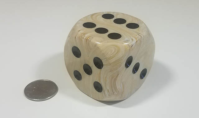 Swirled ivory 50mm d6 with quarter for scale