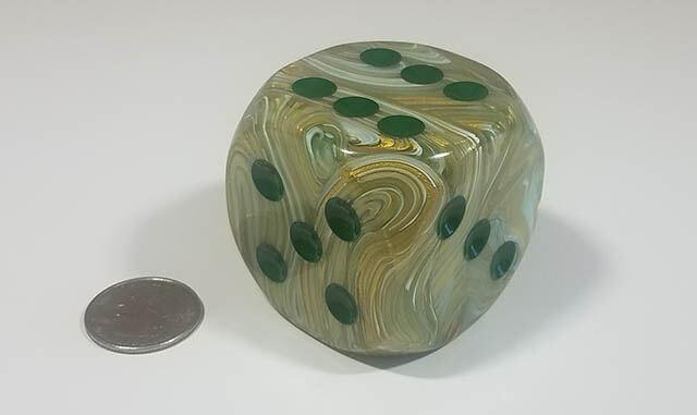 Swirled green and different green 50mm d6 with quarter for scale