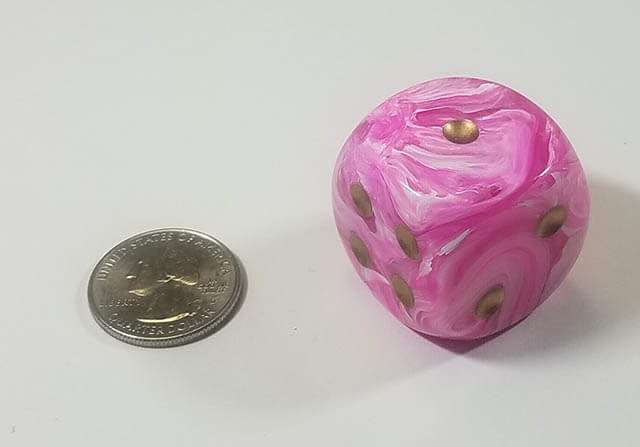 Swirled pink 50mm d6 with quarter for scale