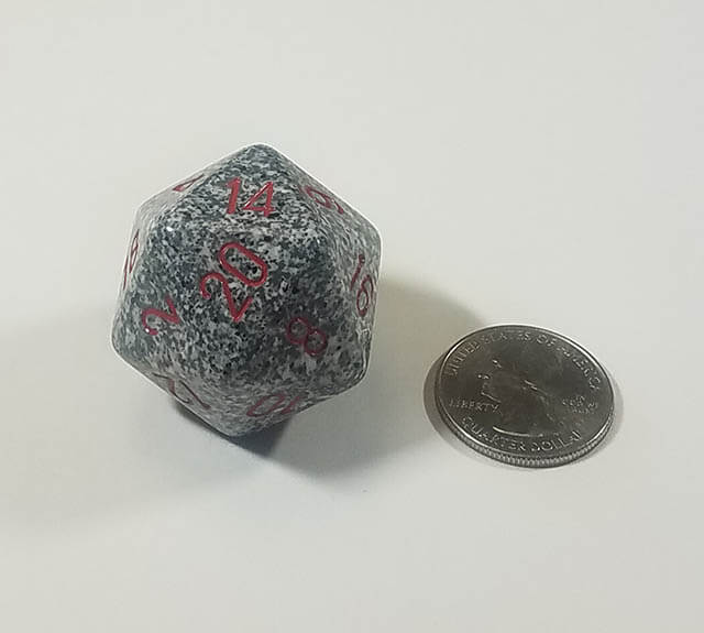 Grey and Black 34mm d20 with quarter for scale. 