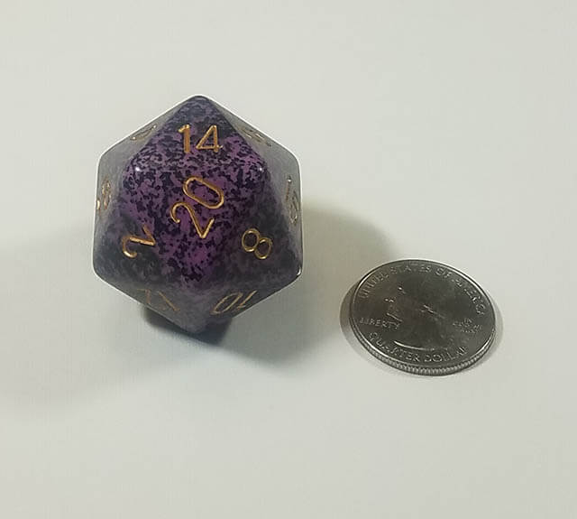 Purple and Black 34mm d20 with quarter for scale. 
