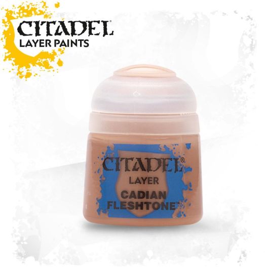 A pot of Citadel Layer paints in the color 'Cadian Fleshtone', designed for painting miniatures.