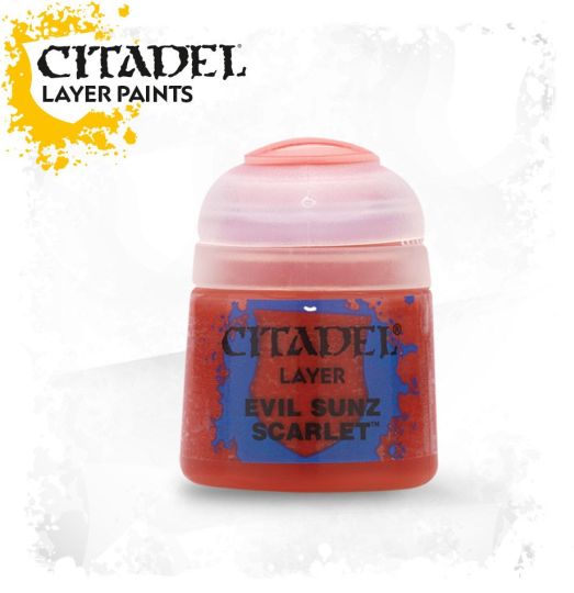 A pot of Citadel Layer paints in the color 'Evil Sunz Scarlet', primarily used for painting miniatures.