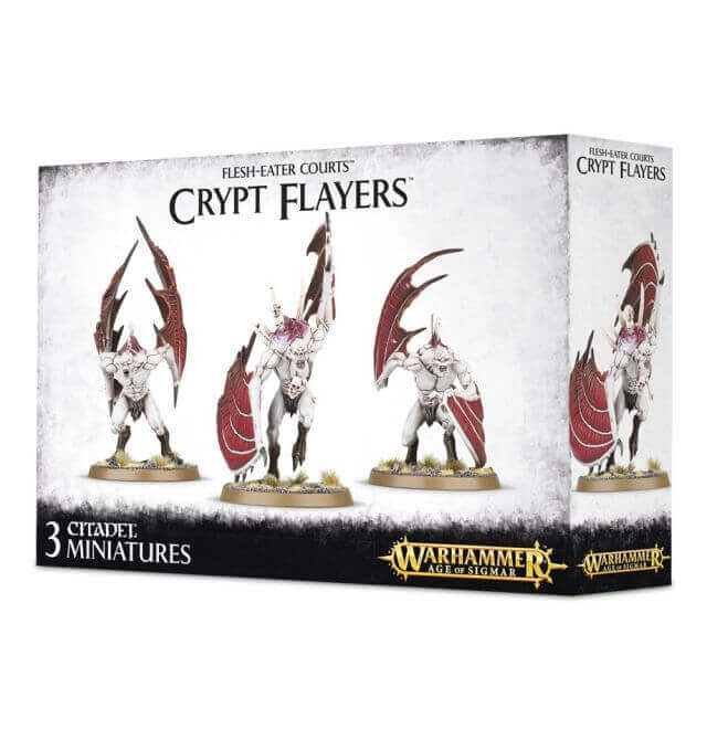 Product packaging for 'Flesh-eater Courts Crypt Flayers' featuring three Citadel miniatures with white and black figures, mounted on a display box with the Warhammer logo.