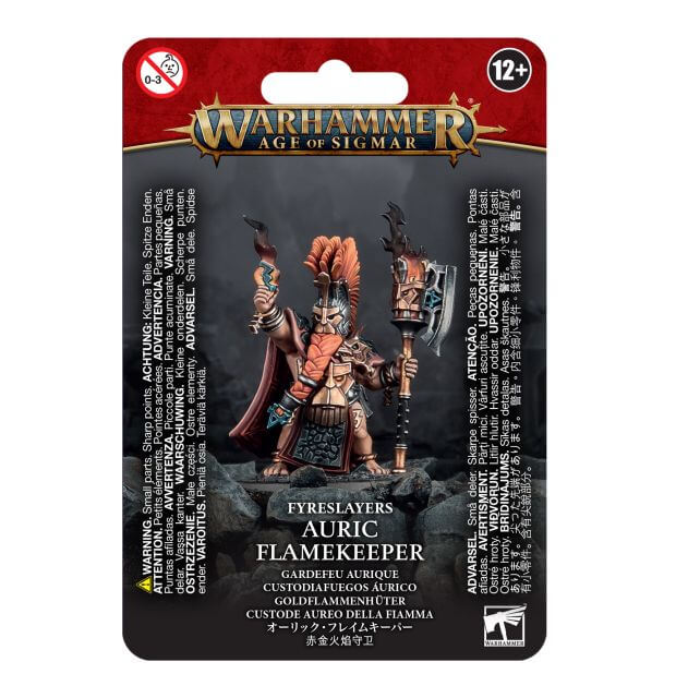 Packaging for Warhammer Age of Sigmar's Fyreslayers Auric Flamekeeper miniature, featuring the assembled and painted model on the front.