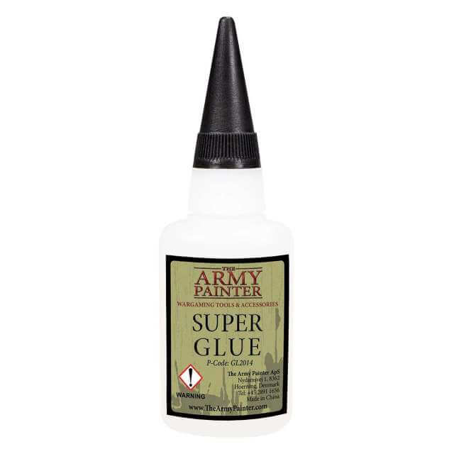 A bottle of Army Painter Super Glue with black cap. 
