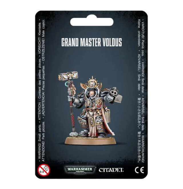 Packaging for Warhammer 40,000 Grey Knights Grand Master Voldus miniature, featuring the assembled and painted model on a black background with game branding.