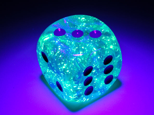 An example of the Chessex Borealis Luminary Icicle with Light blue 30mm d6 under a black light.