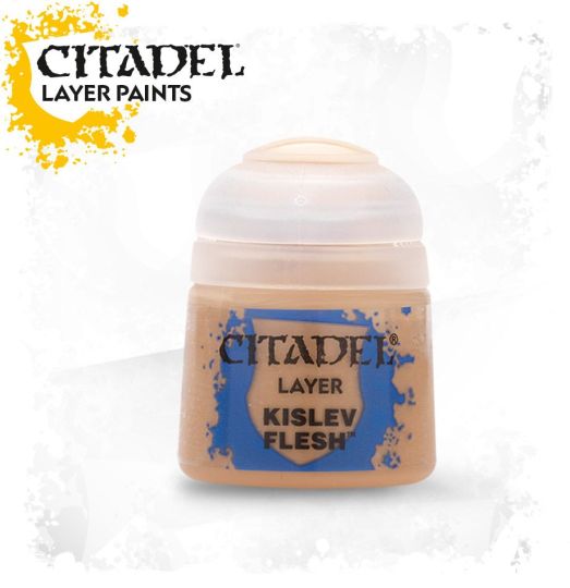 A pot of Citadel Layer paints in the color 'Kislev Flesh'. The paint is designed for use on miniatures and is presented in a small, round, beige pot with the brand and product name labeled on the front.