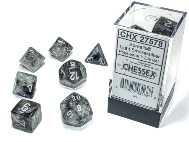 A close up of the  Chessex Borealis Light Smoke with silver polyhedral dice set and its' packaging.