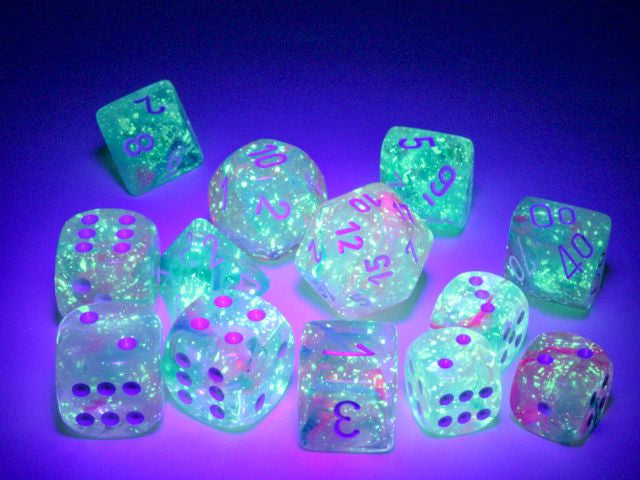 A close up of many dice from the various Nebula Wisteria Dice sets under a black light.