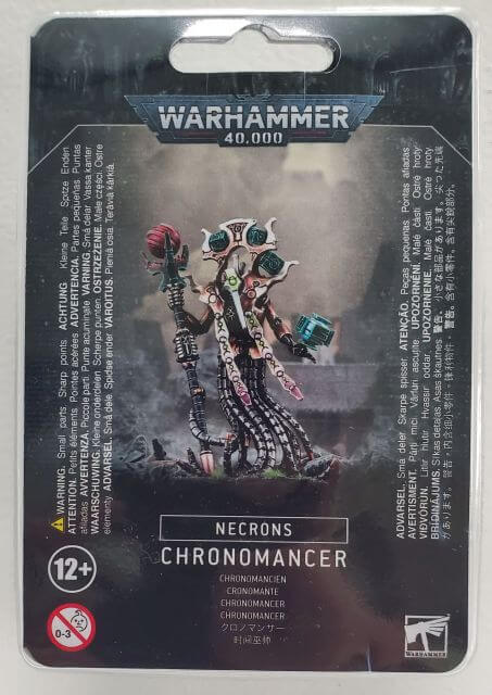 Packaging for Warhammer 40,000 Necron Chronomancer miniature, featuring the model on the front with multiple components visible.