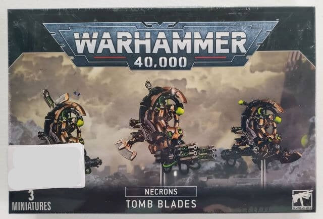 Boxed set of Warhammer 40,000 Necron Tomb Blades miniatures, featuring three assembled and painted models on the front.