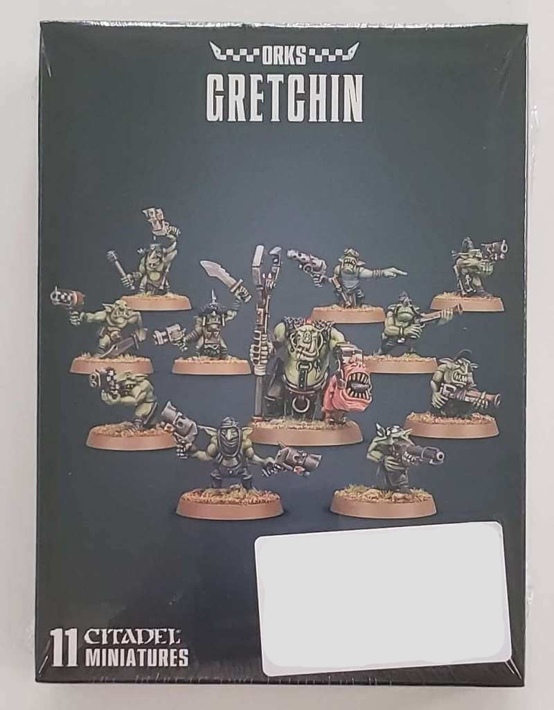 A box set of Ork Gretchin miniatures featuring various figures posed with weapons, packaged in a box with a clear plastic window displaying the models.