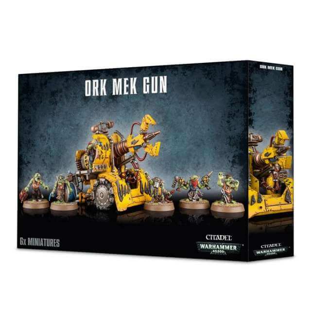 Boxed miniature model set 'Ork Mek Gunz' featuring multiple components and crew members, predominantly in yellow and black colors.