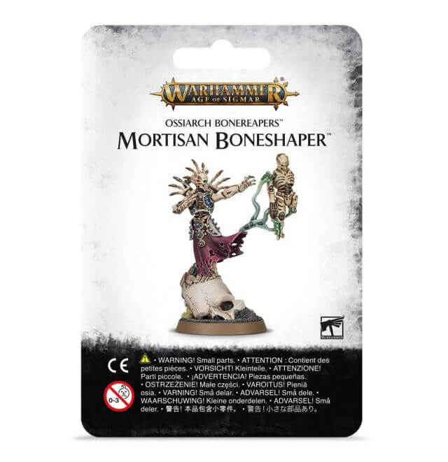 Packaging for the Ossiarch Bonereapers Mortisan Boneshaper miniature, featuring the assembled and painted model on a card with game-related instructions and warnings.