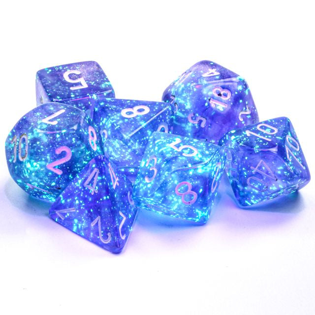 A close up of the Chessex Borealis Purple with white polyhedral dice set.