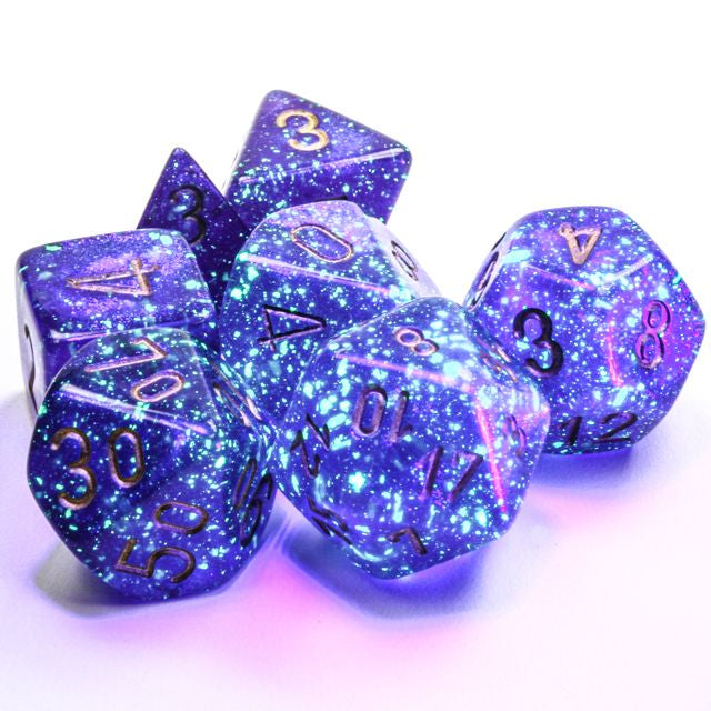 A close up of the Chessex Borealis Royal Purple with gold polyhedral dice set.