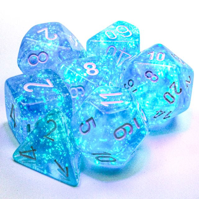 A close up of the Chessex Borealis Sky Blue with white polyhedral dice set.