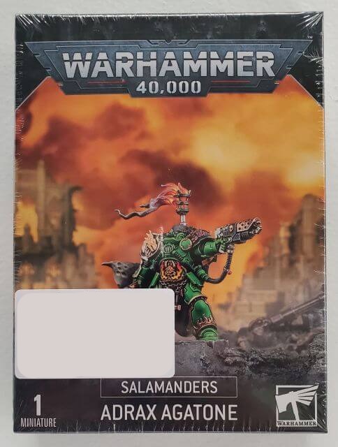 Packaging for Warhammer 40,000 Salamanders Adrax Agatone miniatures set, featuring an illustration of the character Adrax Agatone on a fiery background.