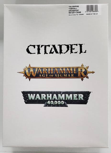 Packaging for Citadel's Warhammer 40,000 Tau Empire Tidewall Droneport, featuring logos and branding.
