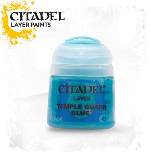 A pot of Citadel Layer paints in the color 'Temple Guard Blue'. The pot is labeled and has a blue lid on a yellow background.
