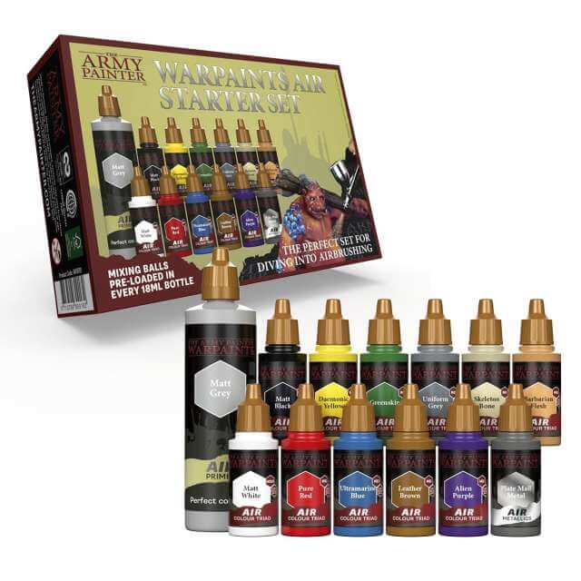 A collection of model painting airbrush colors from The Army Painter, including various colored bottles and a primer bottle, displayed in front of their packaging.