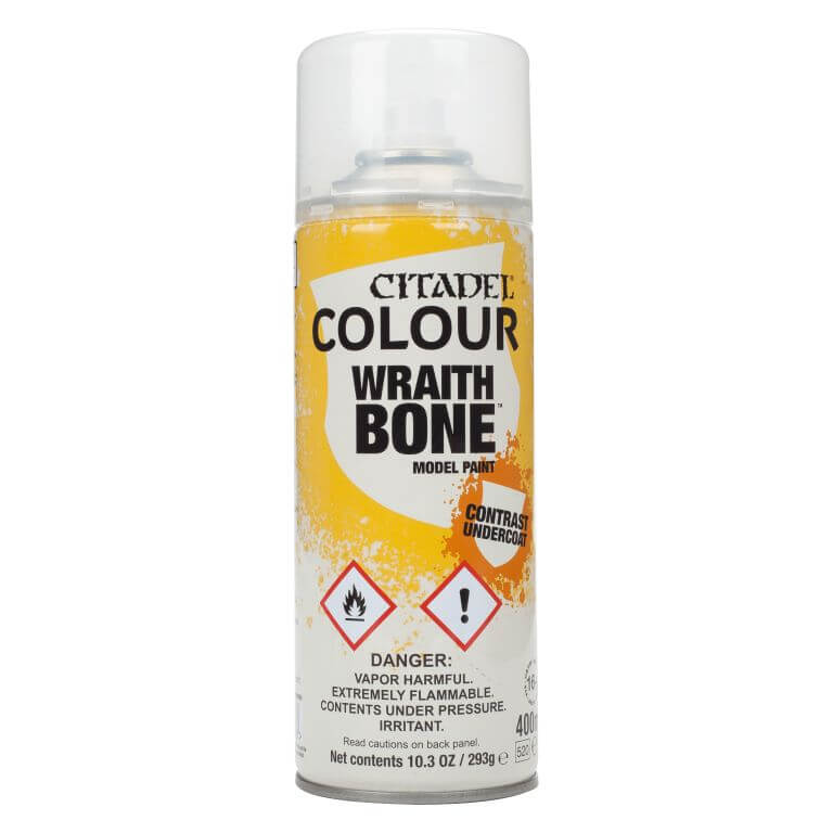 A can of Citadel Contrast Spray paint in the color Wraithbone, primarily yellow and white with product information text and branding.
