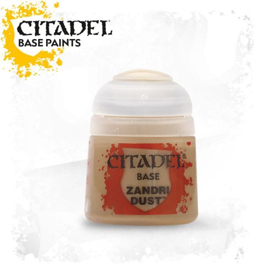 A pot of Citadel Base Zandri Dust paint, primarily beige in color with a white lid, labeled with the brand and product name.