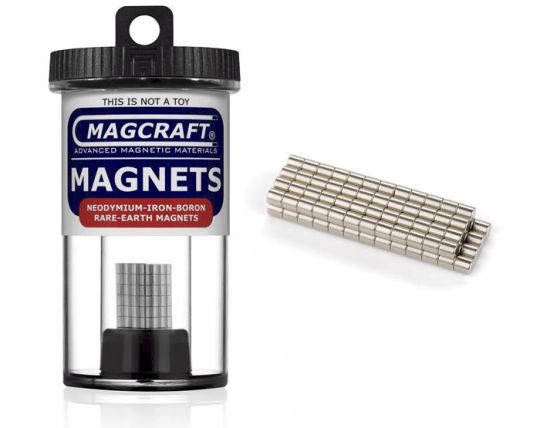 A container of MagCraft rare earth disc magnets, with the magnets visible outside the container. The magnets are silver in color with a shiny metallic finish.